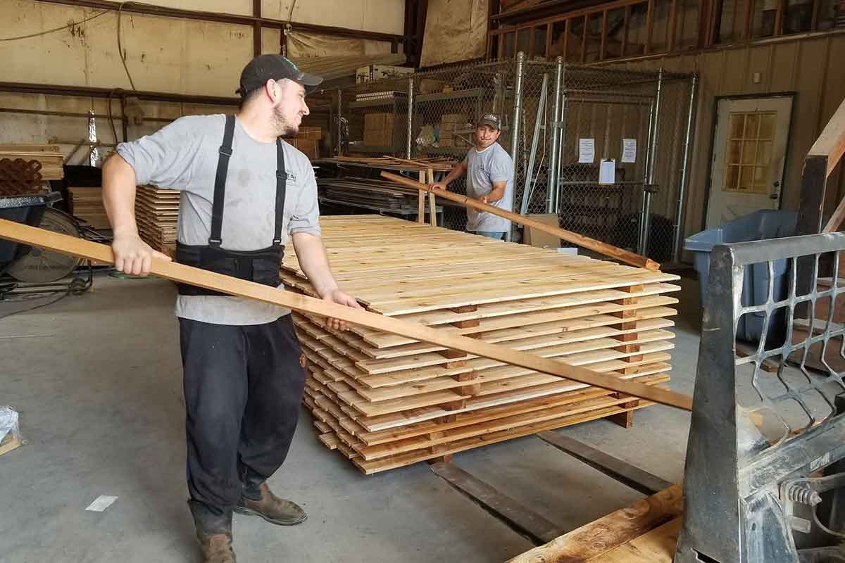 pre-seal technicians stacking fence pickets