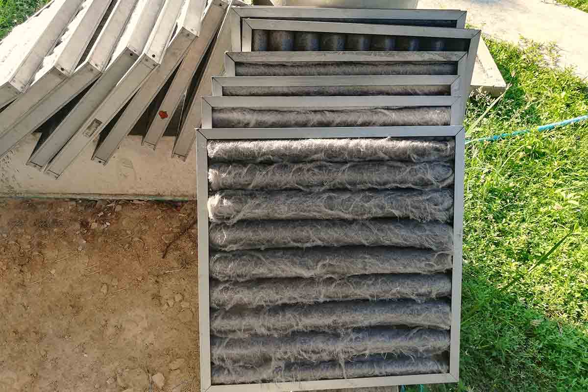 stack of dirty air conditioning filters