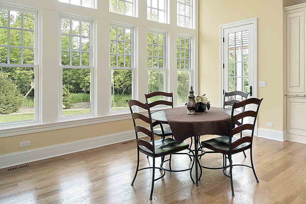 furnished breakfast room with windows