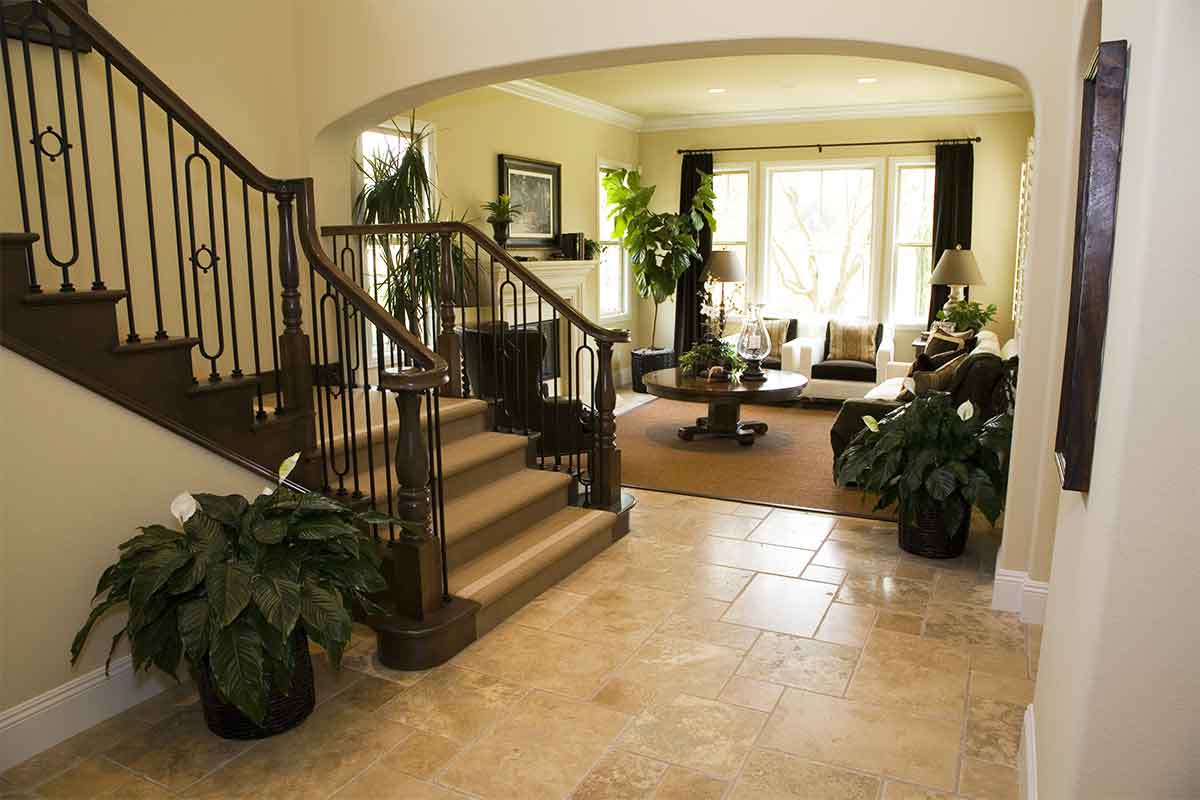 home entryway with beige ceramic tile floor