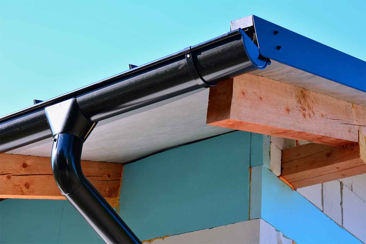 black steel half-round gutters on corner of house