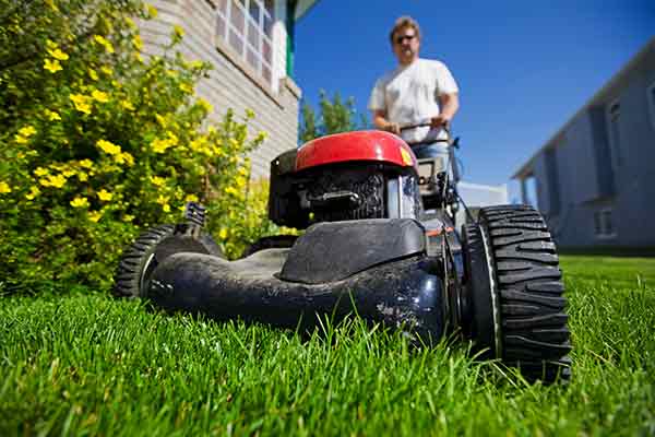 man mowing lawn