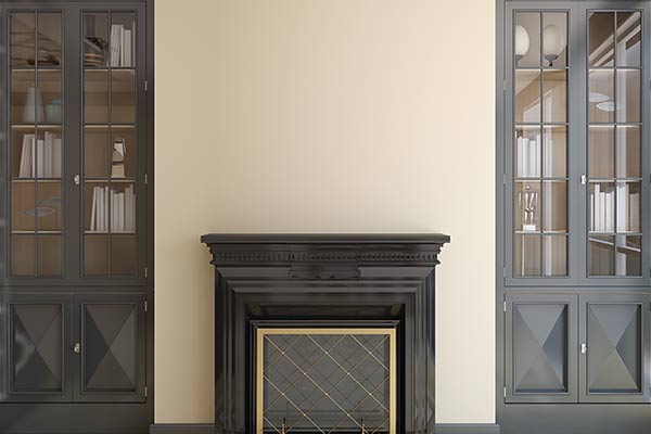 black fireplace against a cream wall