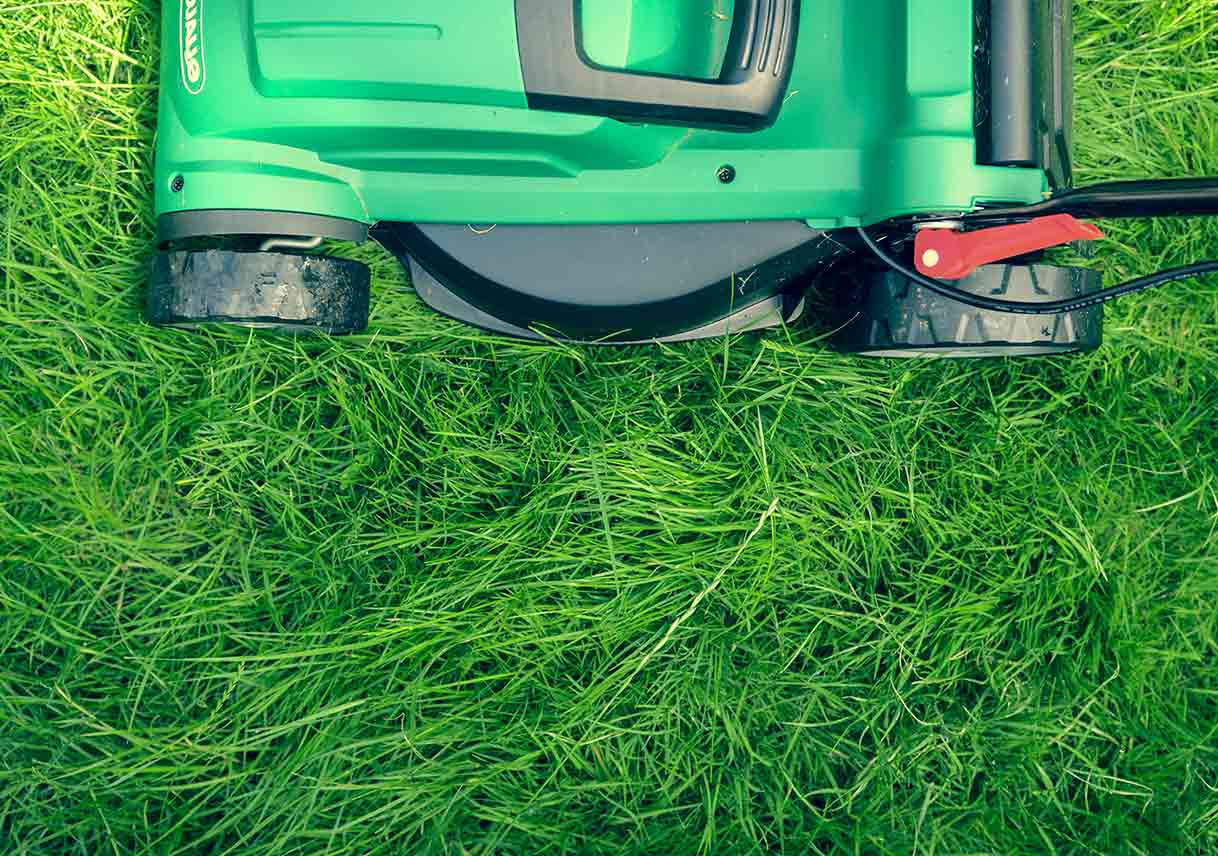 Aerial view of lawn mower on grass