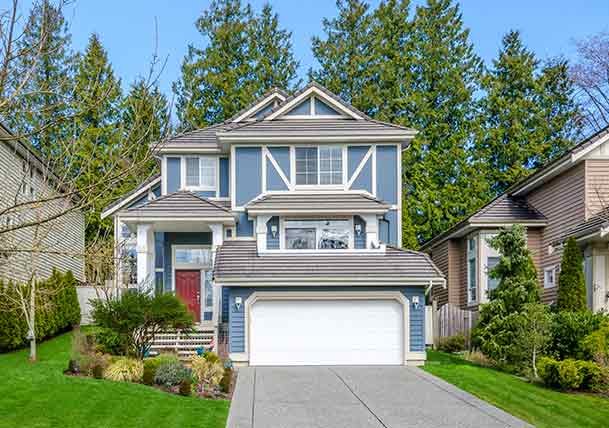 blue house with white trim and a red door