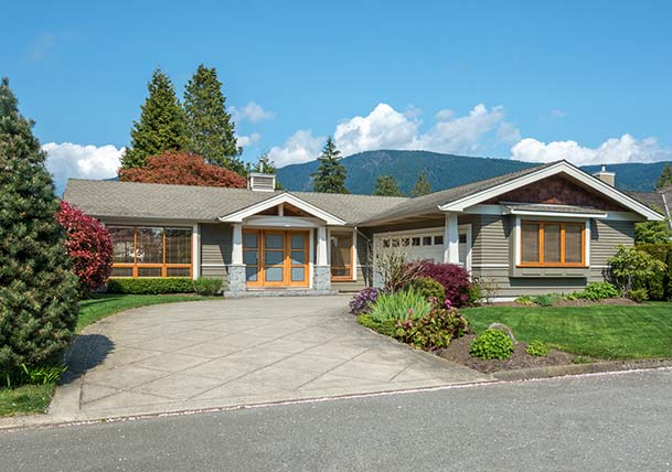 craftsman-style ranch home with orange windows and entryway