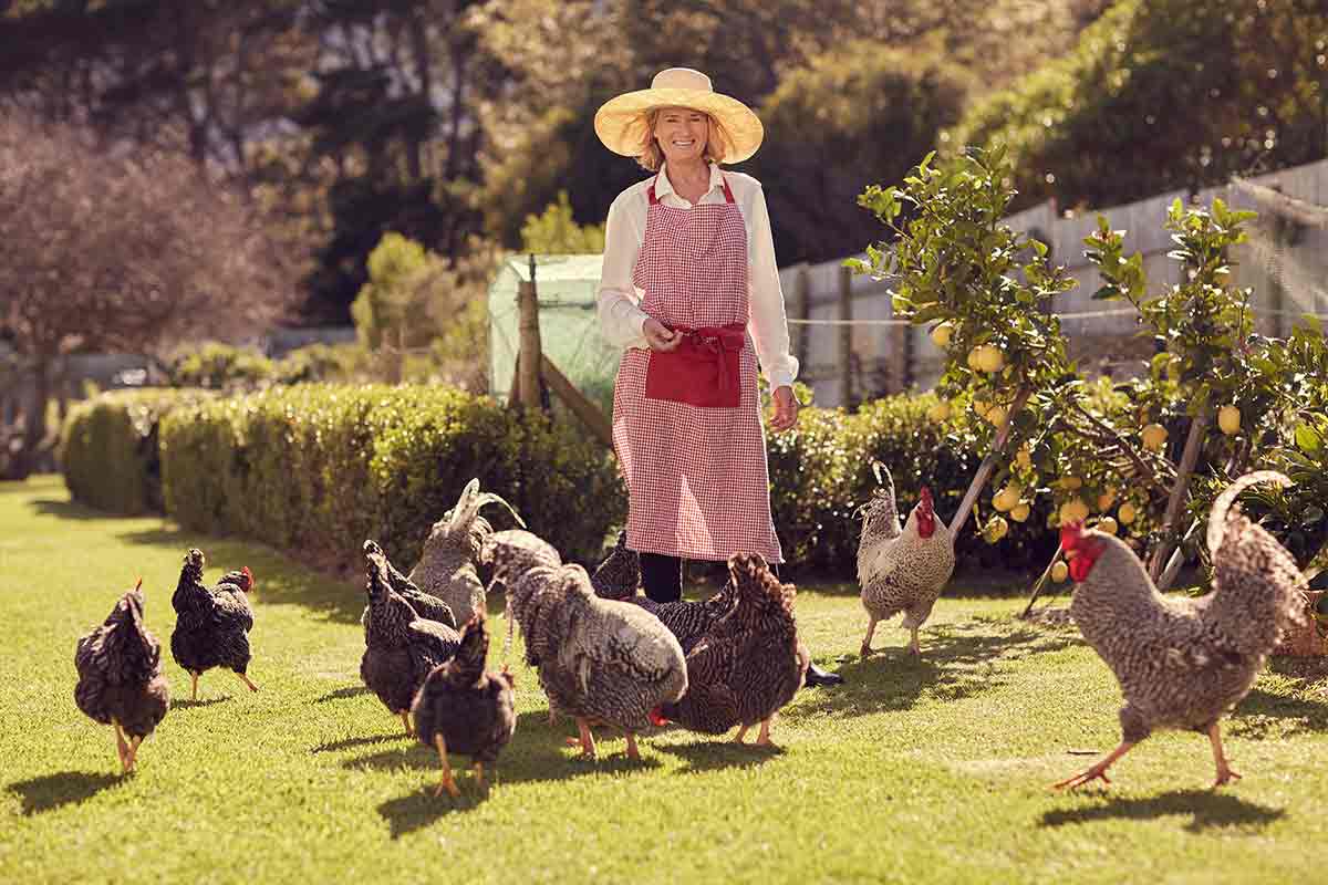 woman with chickens on urban farm