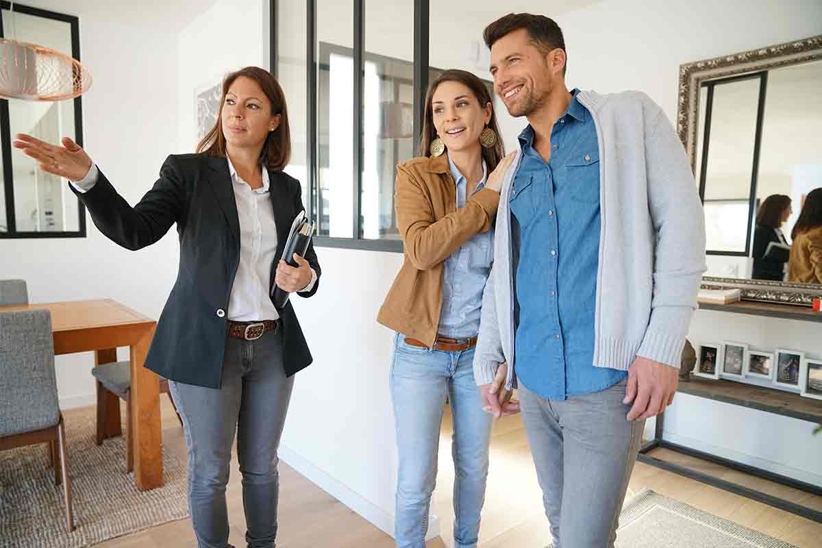 Seller with couple at open house event