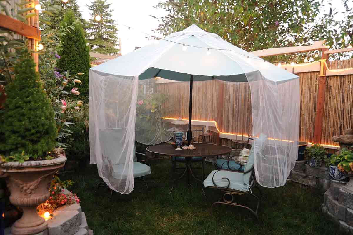 White netting draped over a patio umbrella