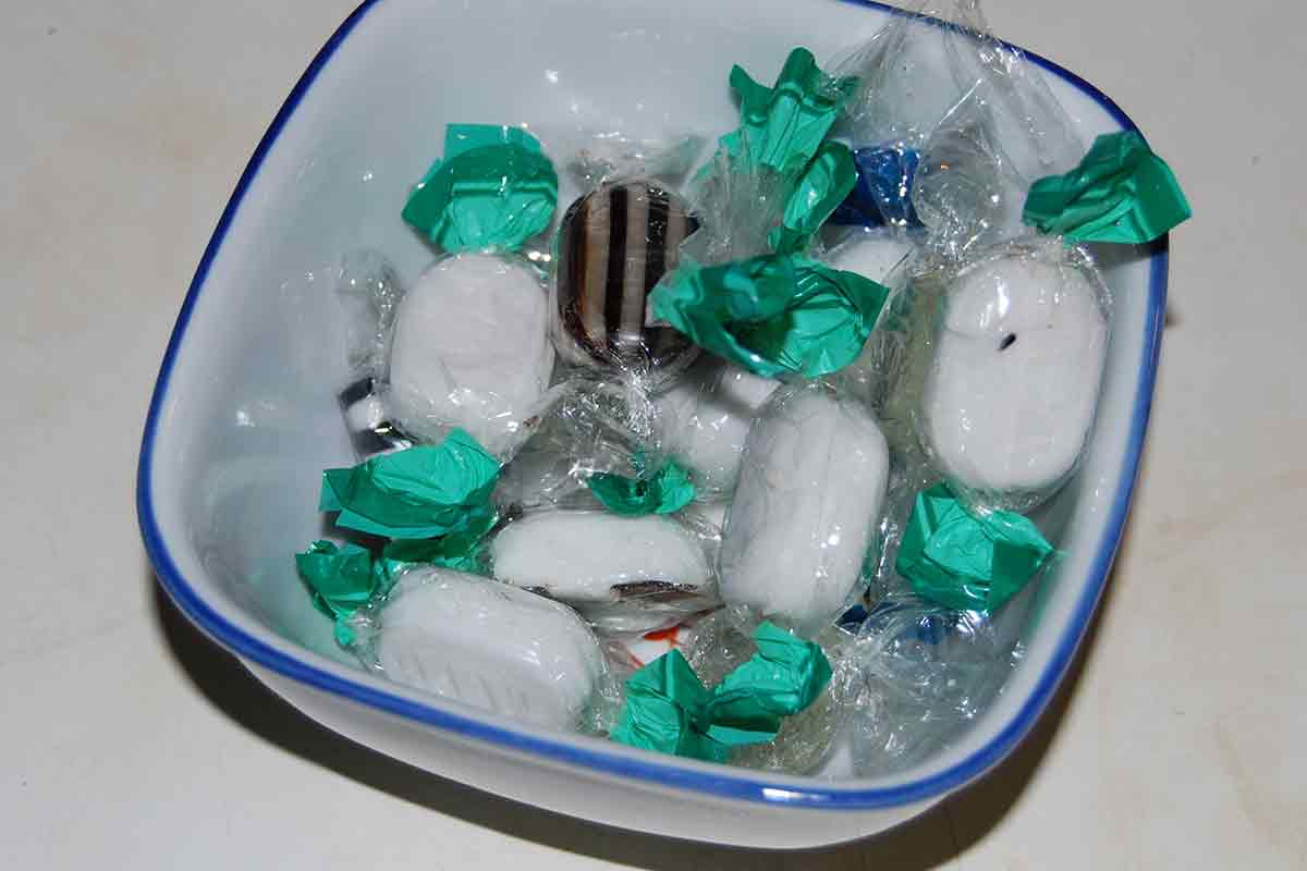 bowl of plastic-wrapped white mints