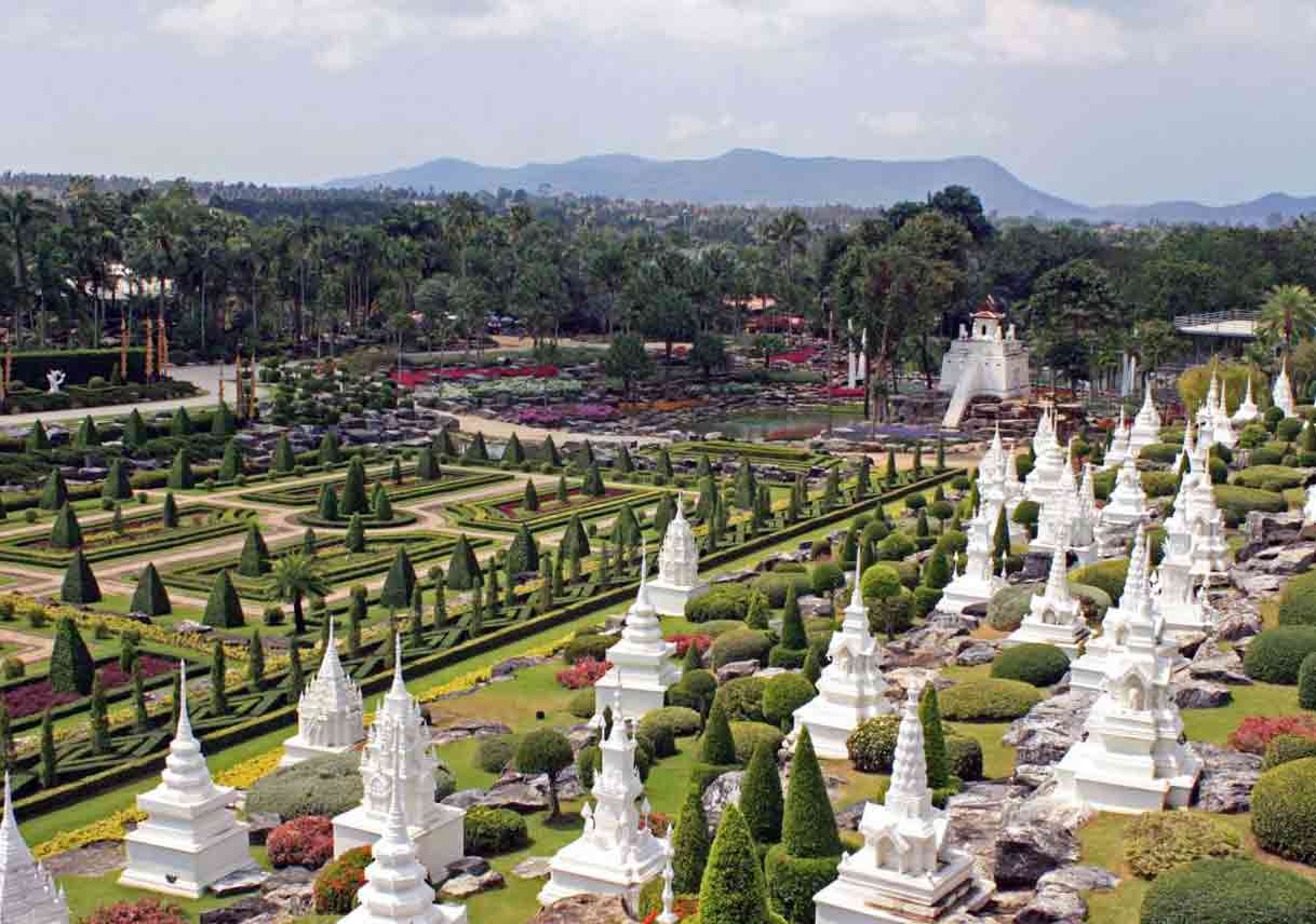 statues amidst various plants