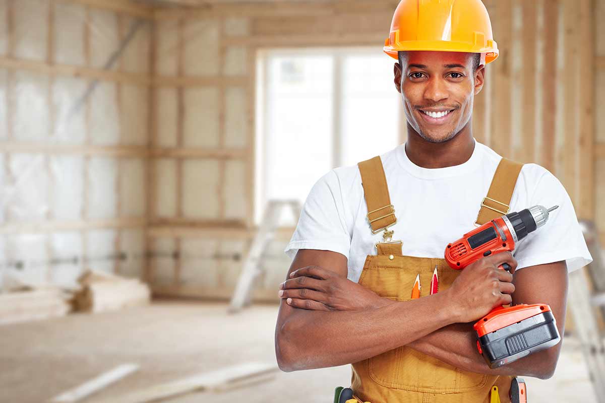 Contractor standing in house under renovation