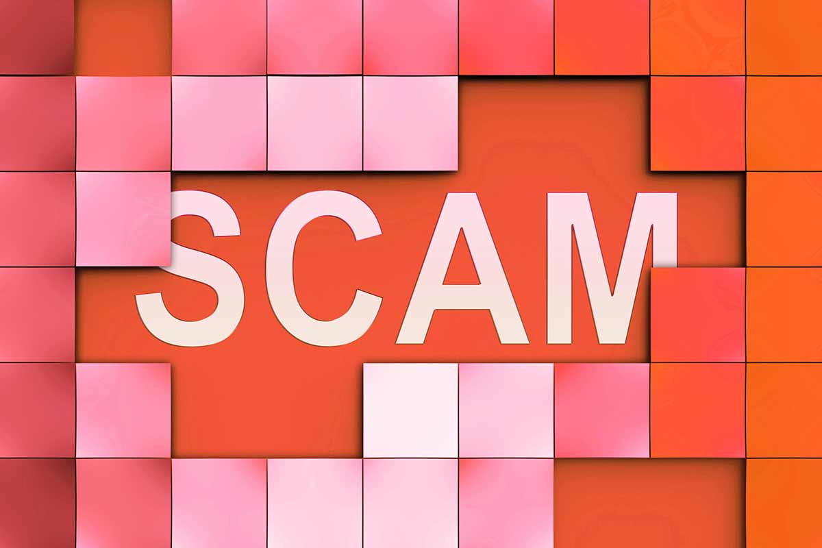 Red and white picture of the word scam