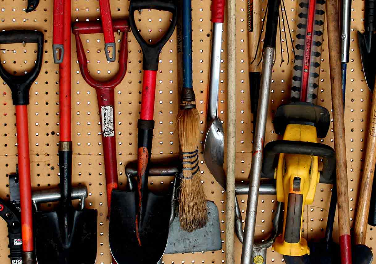 tools hanging on pegboard