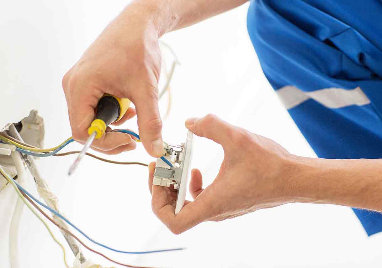 electrician fixing socket