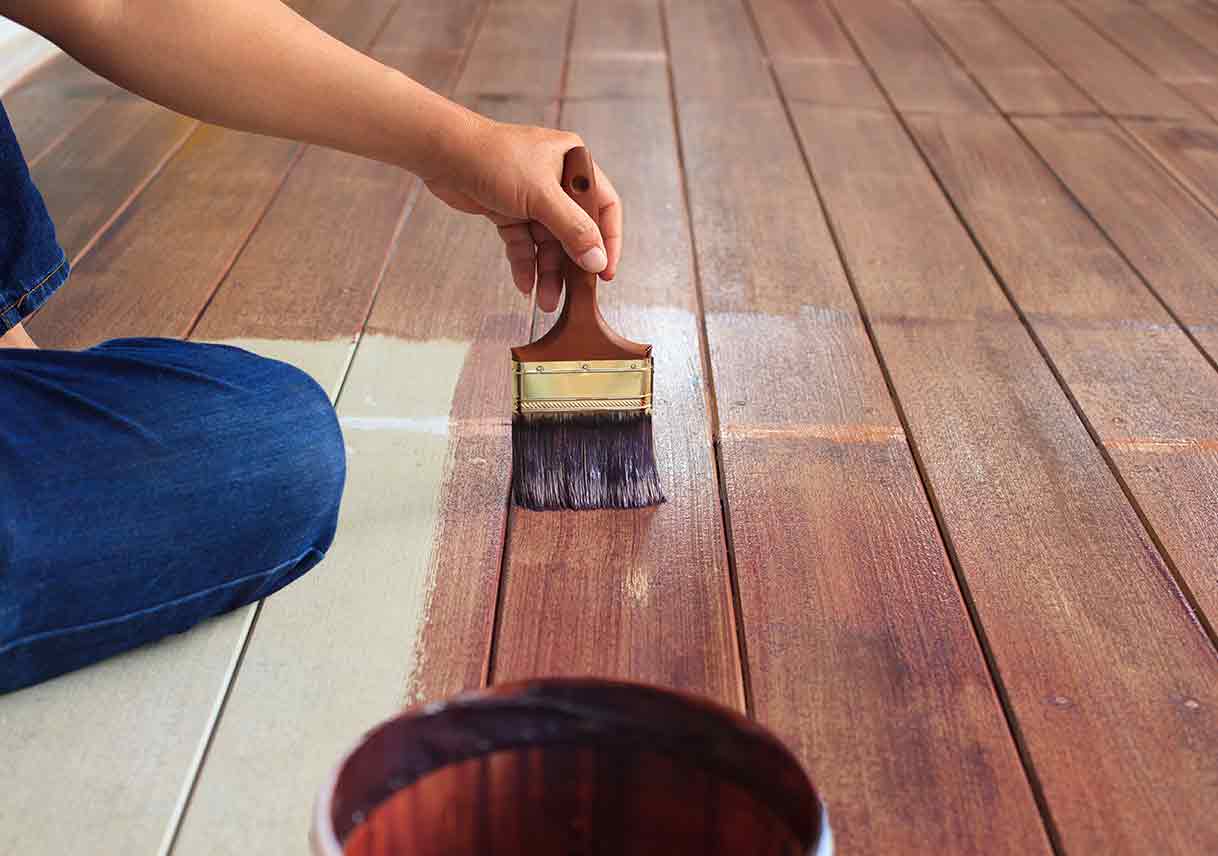 hand painting oil color on wood floor