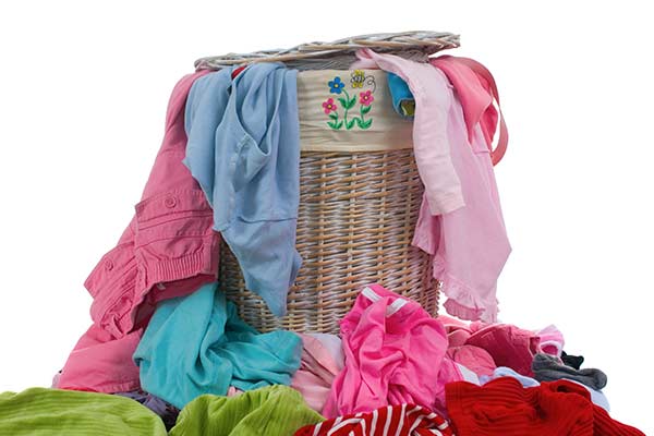 hamper full of colorful dirty laundry