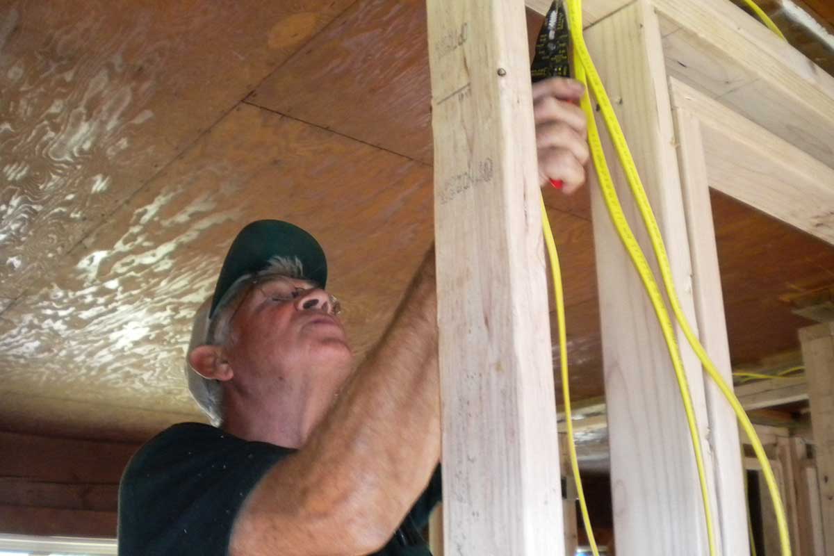 main doing wiring work in home