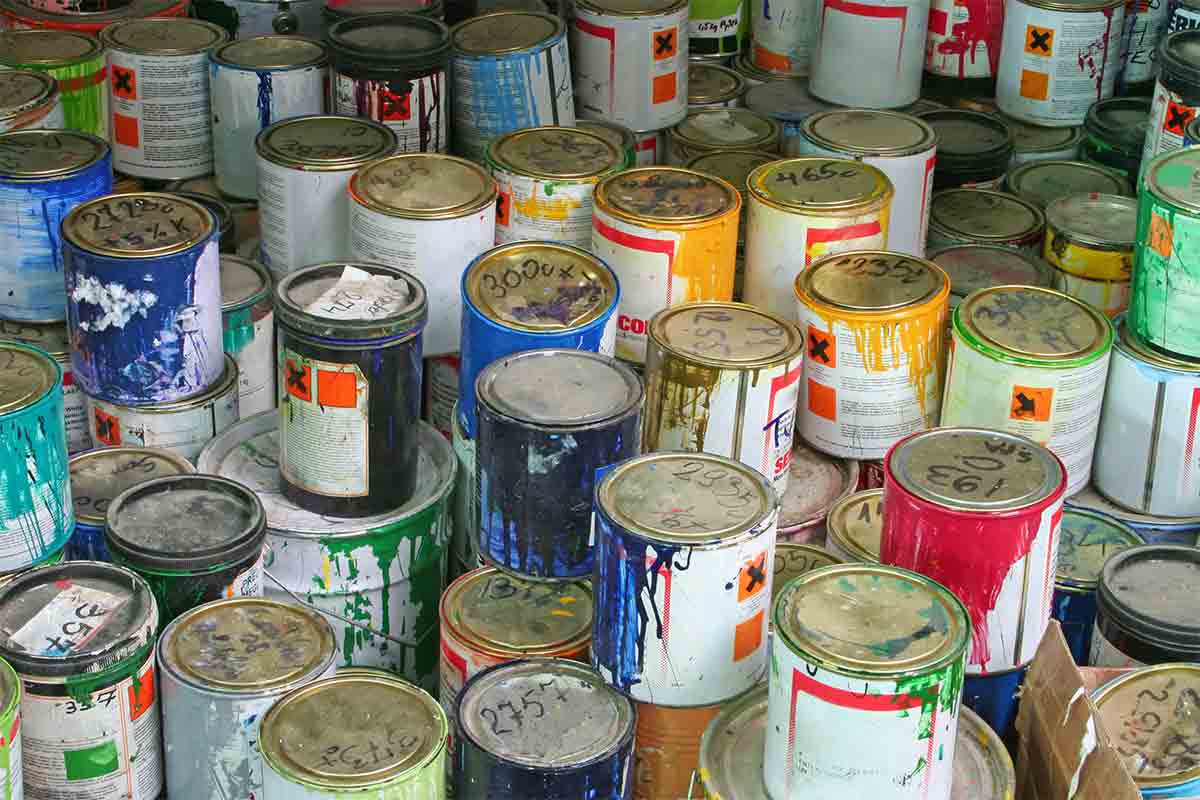 stacks of old paint cans