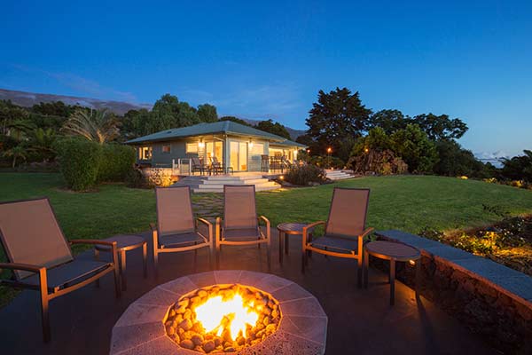 chairs around a lit fire pit