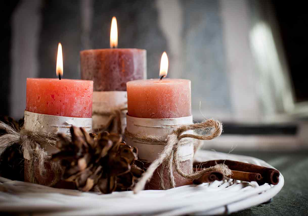 candles with autumn plants as decoration