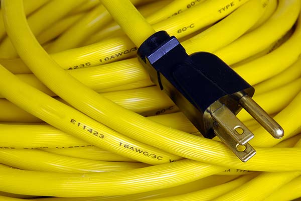 A coiled, yellow extension cable