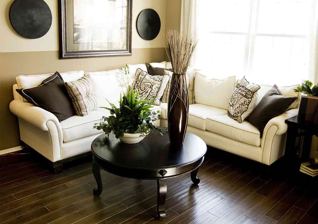 living room area with accent wall split horizontally, the top half painted beige, the bottom brown