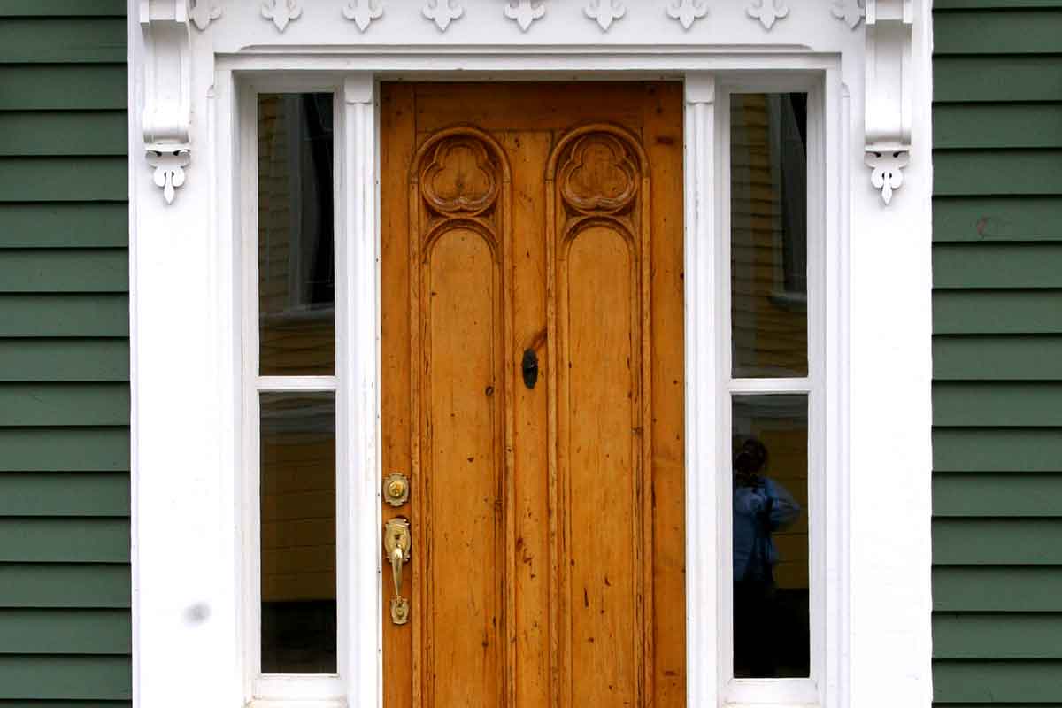 natural wood front door in historic home