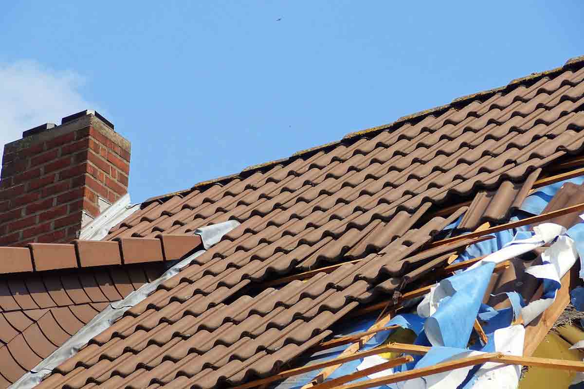 storm-damaged tile roof