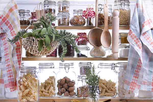 food storage jars with grains in small pantry