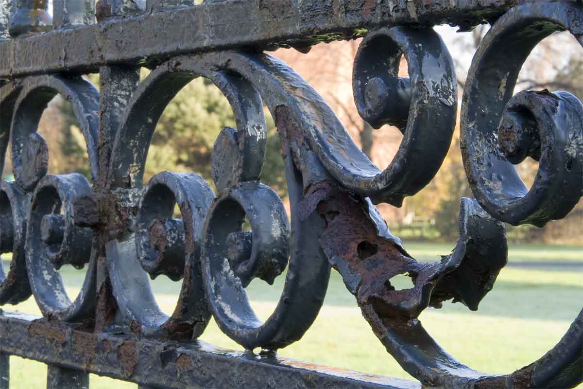 deteriorating wrought iron fence