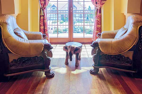 two large chairs with one small table