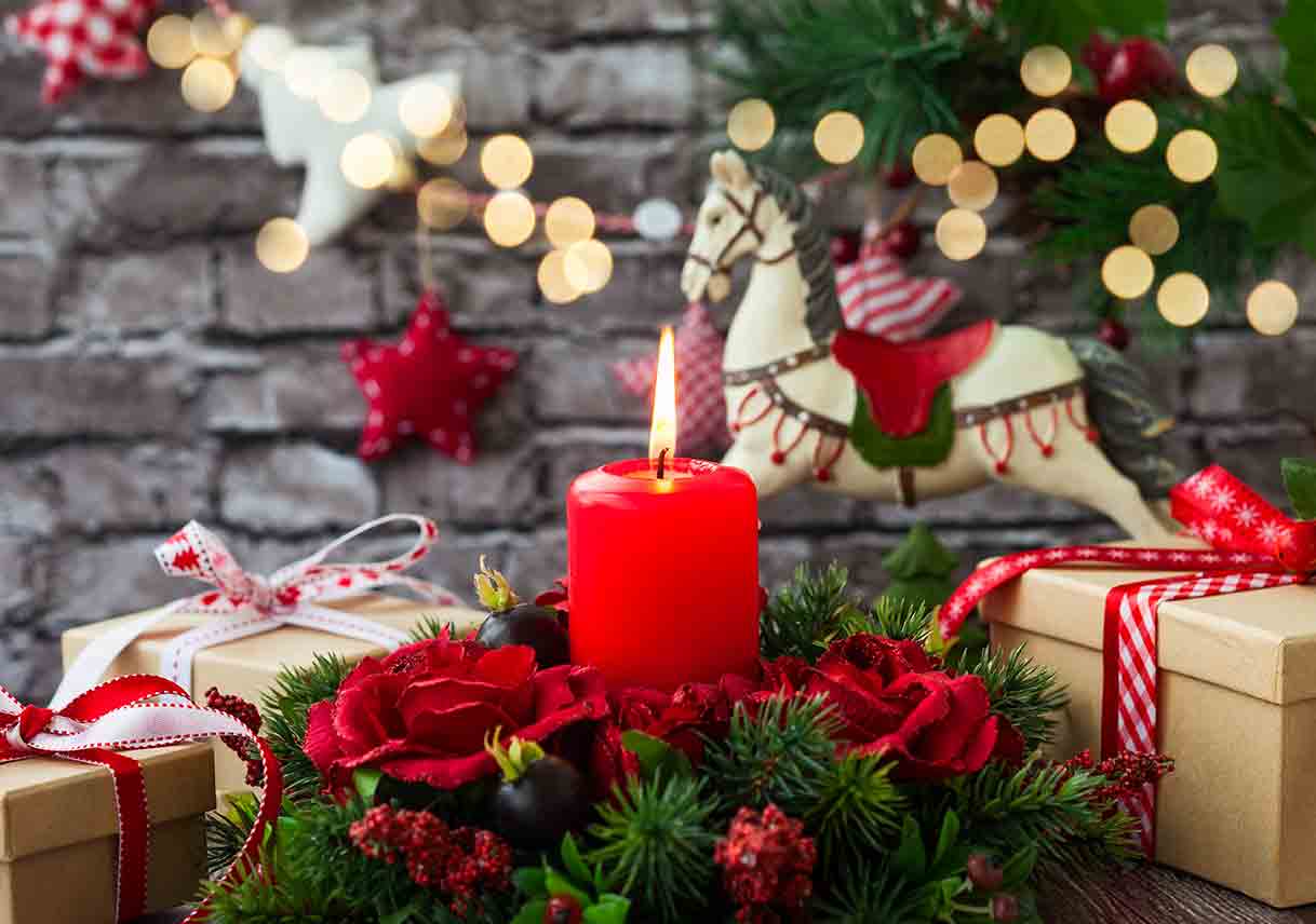 wrapped gifts and a rocking horse in holiday colors