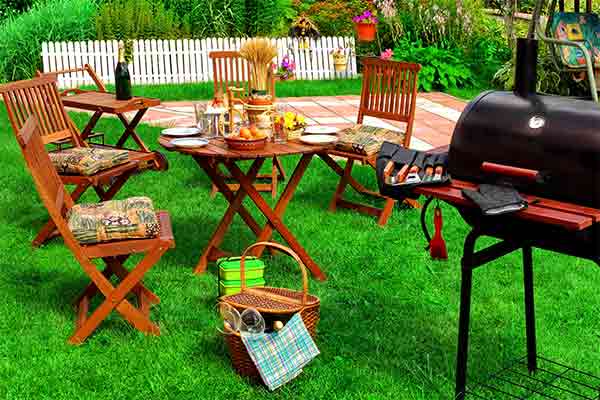 backyard party setup with grill and seats