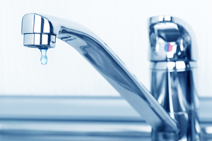 closeup of water dripping from faucet